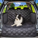 Long haired dog sitting on Meadowlark Cargo Liner Protector in trunk of vehicle.