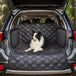 Long haired dog sitting on Meadowlark Cargo Liner Protector in trunk of vehicle.